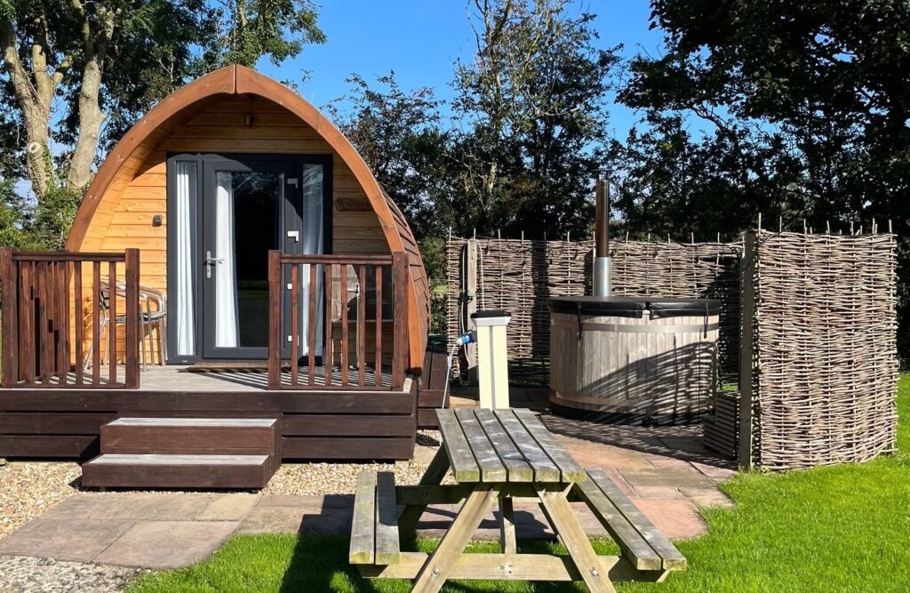 Wild wellness Hadrian's Wall blog - shephard's hut with a hot tub next to it